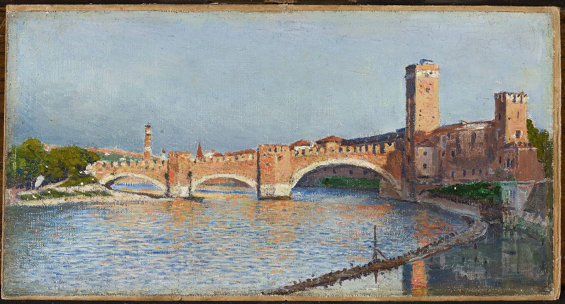 The crenellated brick arches of the Ponte Scaligero cross the shimmering Adige to the towers of Castelvecchio under a pale blue sky.