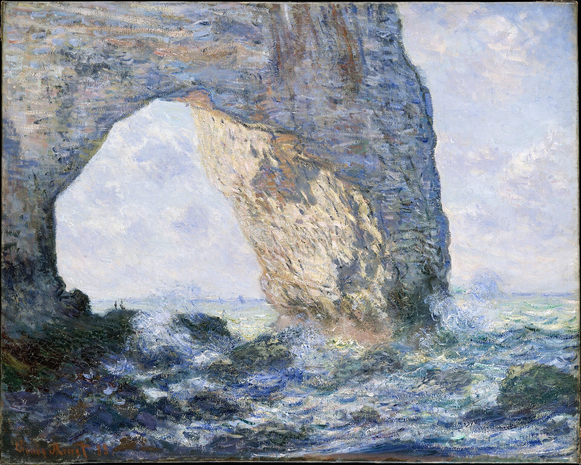 The Manneporte, a great natural rock arch on the Normandy coast at Étretat, with the sea breaking at its foot