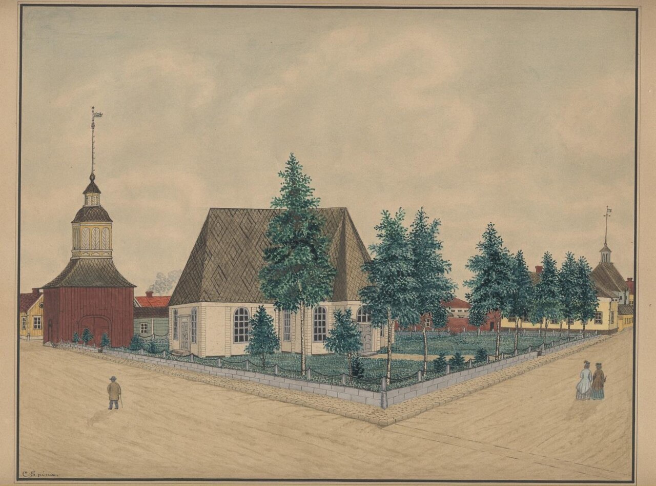 A naive watercolour of Kokkola's old wooden church with its steep shingled roof, the red bell tower with an onion cupola on the left, spruces in the fenced churchyard, and yellow town houses with a small cupola on the right.